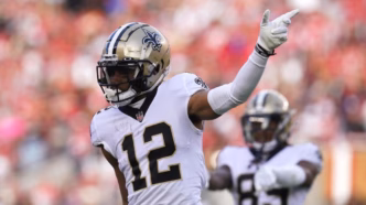 Chris Olave, recebedor do New Orleans Saints, em ação.