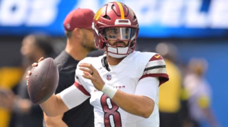 Marcus Mariota, quarterback do Washington Commanders, em ação durante um jogo da NFL.